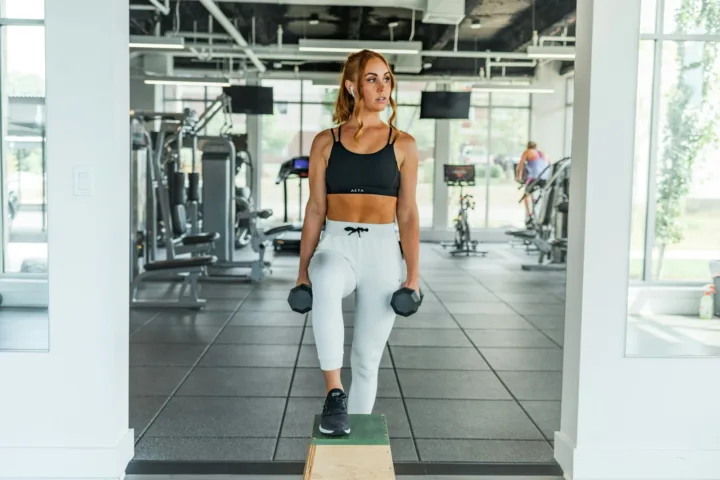 Woman holding a pair of dumbbells