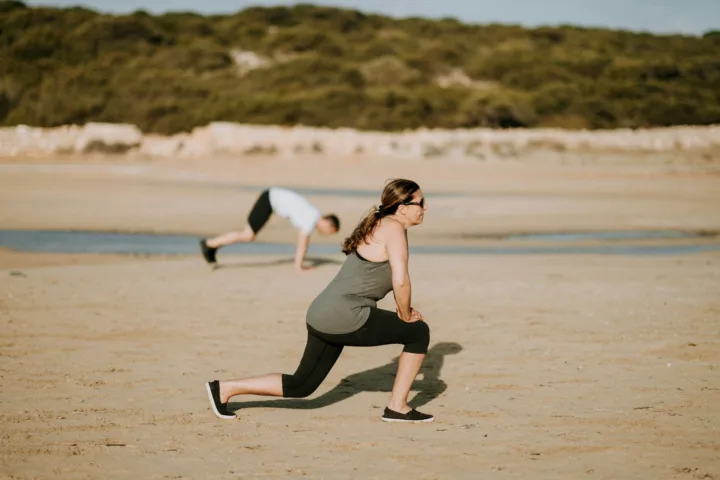Woman doing a lunge to work her thighs